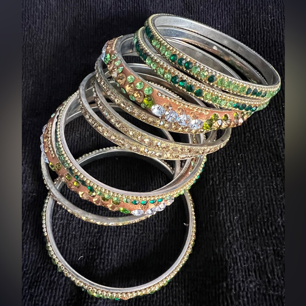 Stunning stack of gold and green gemstone bangle bracelets